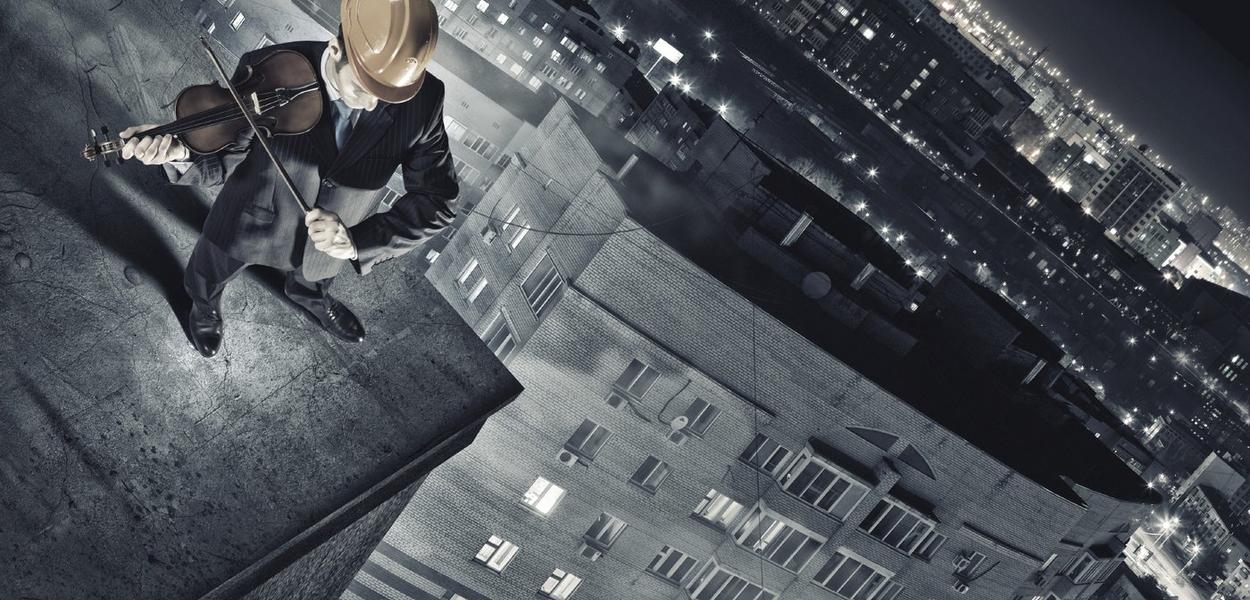 Top view of young businessman playing violin